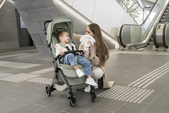 A parent and toddler with the Britax Flylite at an airport