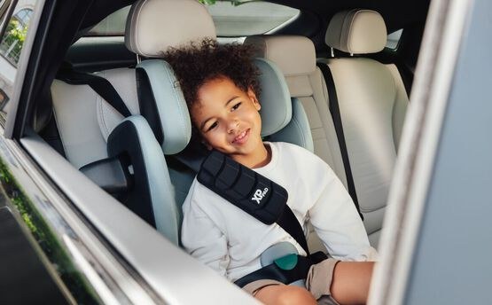 Britax KIDFIX PRO installed in a car with a child safely seated — side and frontal impact protection